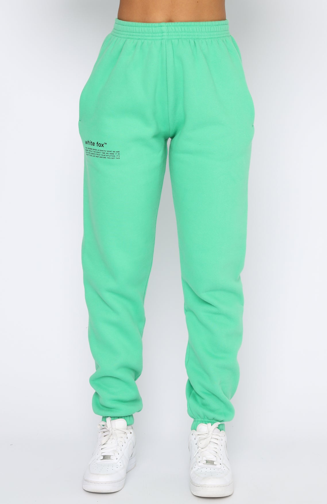 Green and white hot sale track pants