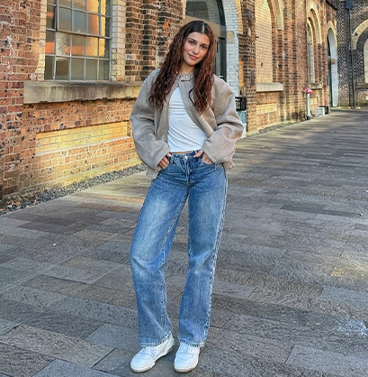 Student ambassador in cozy jeans and jacket